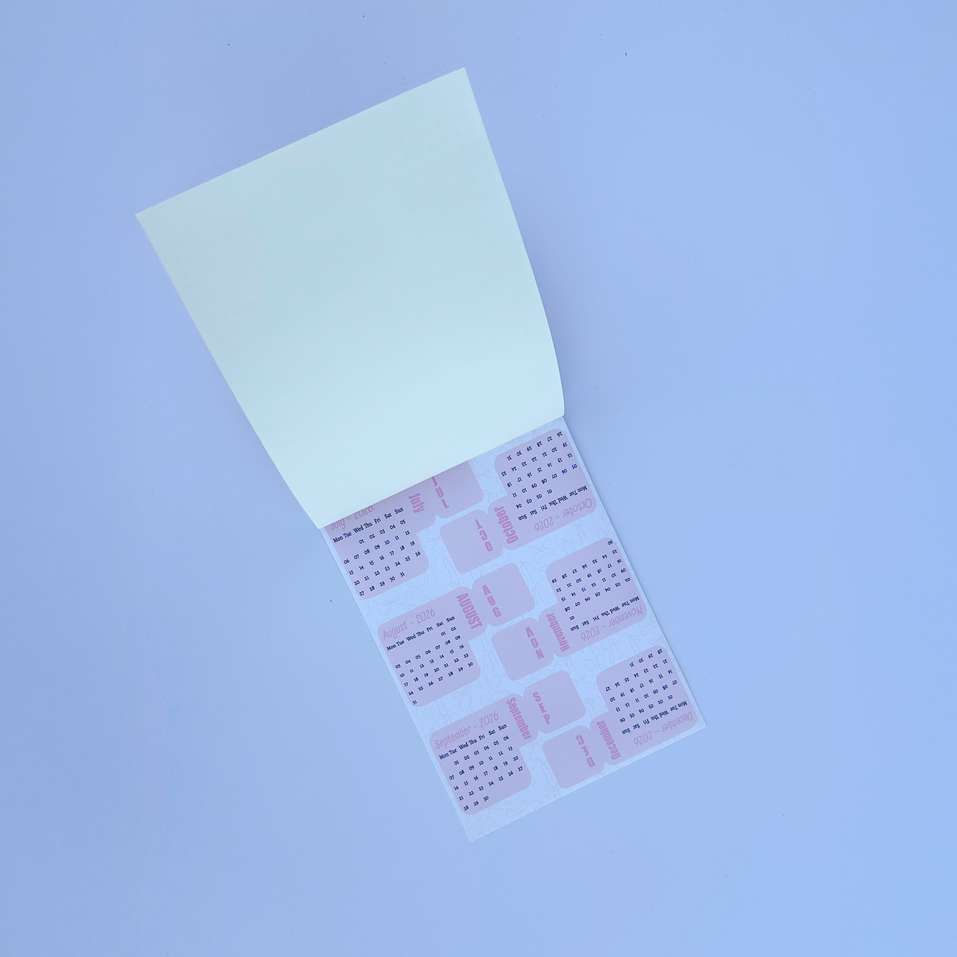 Sheet of pink stickers with a grid pattern on a white background