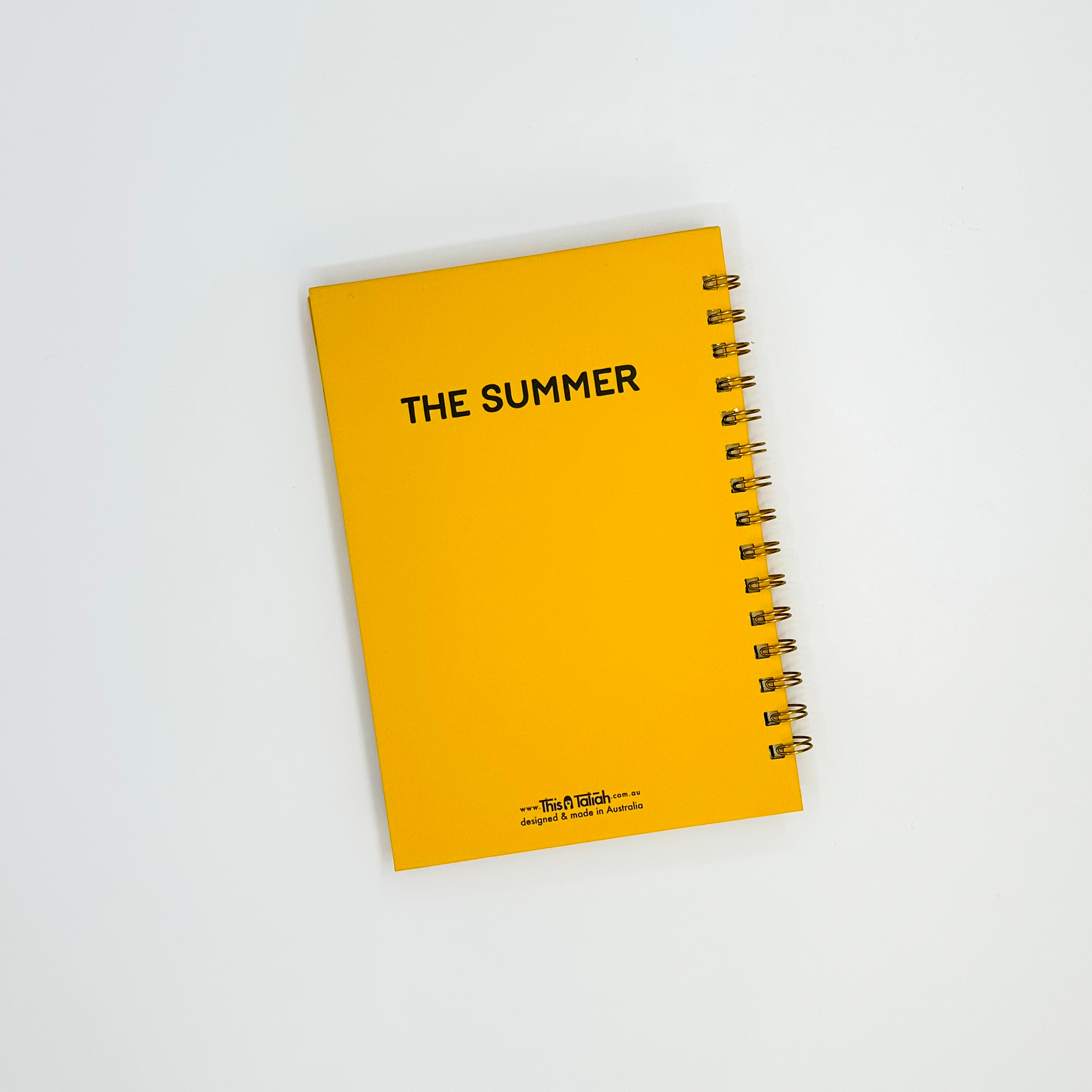 Notebook back cover, yellow with 'The Summer' text on a white background