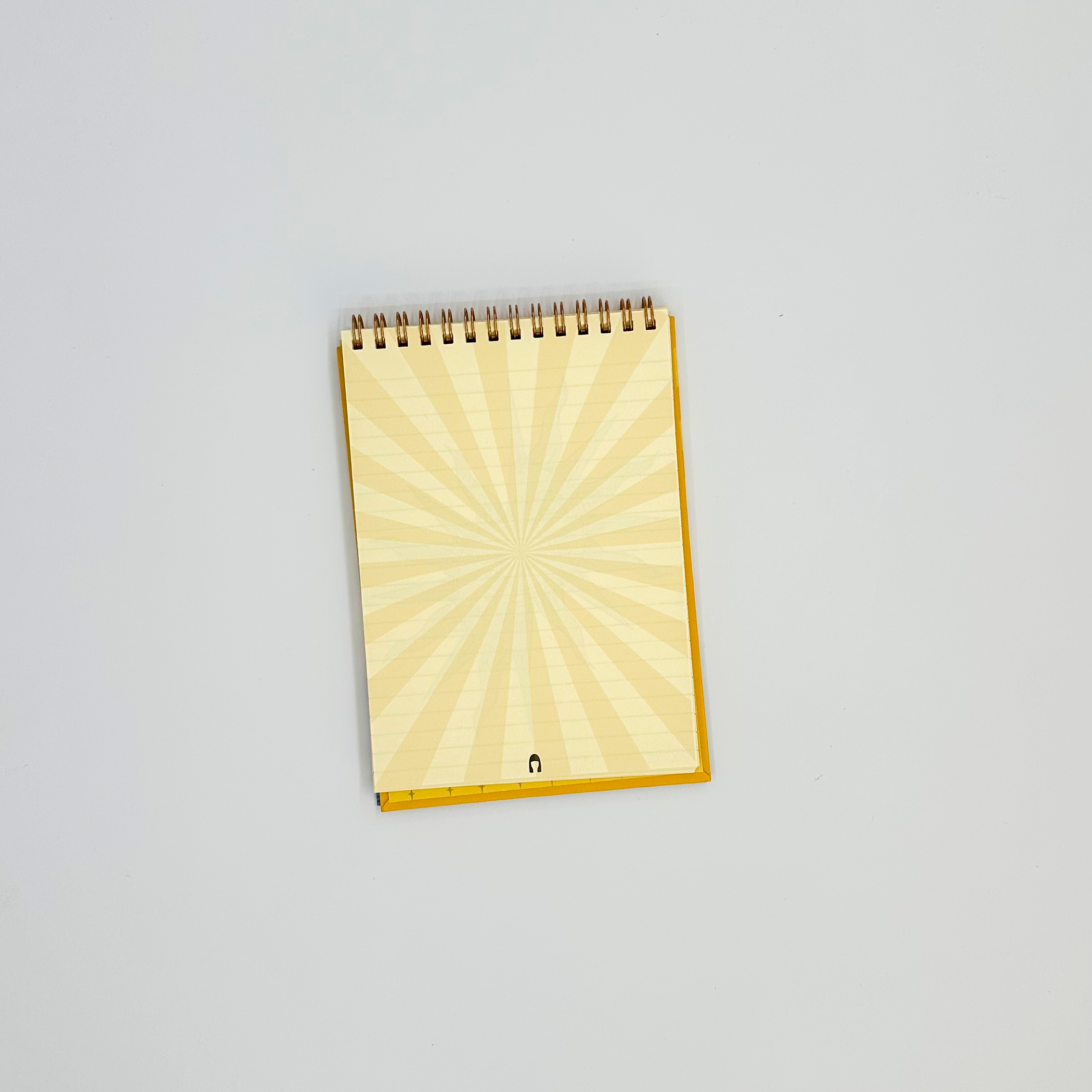Notepad page with a sunburst pattern on a white background
