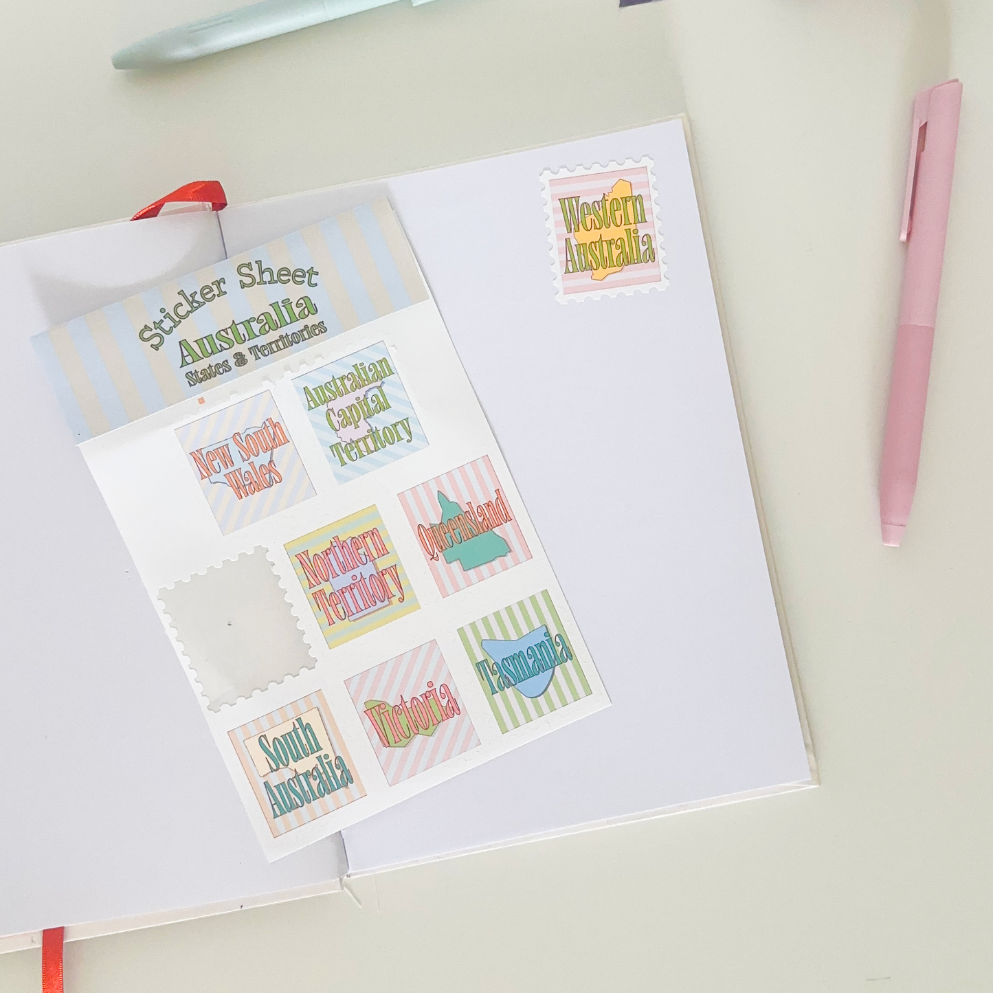 Sticker sheet with 8 different stickers with australian's states and territories in a vintage design with soft colours